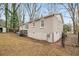 View of the house's exterior and partially fenced backyard at 1438 Joy Ln, Decatur, GA 30032