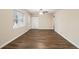 Spacious living room featuring hardwood floors, fresh paint, and a view to the front yard at 1438 Joy Ln, Decatur, GA 30032