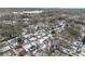 Panoramic aerial shot showcases a snow-covered neighborhood, featuring houses nestled among bare trees at 2003 Cogar Dr, Decatur, GA 30032