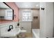 Charming renovated bathroom with modern fixtures, stylish tile and a large window at 2003 Cogar Dr, Decatur, GA 30032