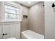 Neutral bathroom features modern gray tile in herringbone pattern and window at 2003 Cogar Dr, Decatur, GA 30032