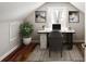 Attic office space featuring a desk, chair, modern decor, and a window at 2003 Cogar Dr, Decatur, GA 30032