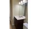 Traditional bathroom features single sink vanity, decorative mirror and lighting at 3611 Spring Pt, Decatur, GA 30034