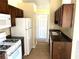 The kitchen has granite countertops, tile floors and wooden cabinets at 3611 Spring Pt, Decatur, GA 30034