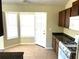 The eat-in kitchen features tiled floor, cabinetry, and a bay window at 3611 Spring Pt, Decatur, GA 30034