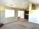 Bright living room features neutral walls, carpeted floors, and ceiling fan at 3611 Spring Pt, Decatur, GA 30034