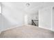 A view of the carpeted room with stairs and railing to the right at 96 Trailview Lane Ln, Hiram, GA 30141