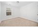 A standard bedroom with neutral colored carpet and a view to the exterior at 96 Trailview Lane Ln, Hiram, GA 30141