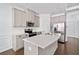 Bright kitchen with stainless steel appliances and white subway tile backsplash, adjacent to island at 96 Trailview Lane Ln, Hiram, GA 30141