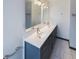 Bathroom featuring a double sink vanity, modern fixtures, and a neutral color palette at 1017 Martin Luther King Jr Dr, Atlanta, GA 30314