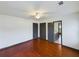 Spacious bedroom featuring hardwood floors, ceiling fan, and two storage closets at 1017 Martin Luther King Jr Dr, Atlanta, GA 30314