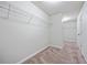 Large walk-in closet with carpeted flooring and wire shelving for optimal storage at 2098 Bridgewater Pass, Hampton, GA 30228