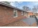 Exterior view of home featuring a backyard deck and traditional red brick at 4624 College St, Forest Park, GA 30297