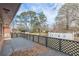 Spacious backyard deck with black lattice railing, offering ample space for outdoor relaxation at 4624 College St, Forest Park, GA 30297