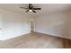 Clean and bright room features new floors, neutral wall colors, and a ceiling fan at 4624 College St, Forest Park, GA 30297