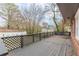 Spacious, shady deck with lattice railing offers a tranquil spot for relaxation and entertainment at 4624 College St, Forest Park, GA 30297