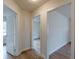 Bright hallway with modern flooring and access to multiple rooms at 4624 College St, Forest Park, GA 30297