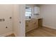 Convenient laundry area with modern countertops, a sink, and storage at 4624 College St, Forest Park, GA 30297