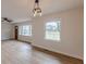 Spacious living room with new floors, natural light, and modern lighting at 4624 College St, Forest Park, GA 30297