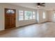 Bright living room with modern flooring, neutral walls, and updated lighting at 4624 College St, Forest Park, GA 30297