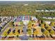 Aerial view of a neighborhood community featuring a clubhouse, swimming pool, and tennis courts at 507 Ridge View Xing, Woodstock, GA 30188