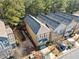 Aerial view of townhomes showcasing roof lines, driveways, and compact backyard spaces at 507 Ridge View Xing, Woodstock, GA 30188