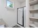 Bathroom featuring tiled flooring, walk-in shower, and built-in shelving at 507 Ridge View Xing, Woodstock, GA 30188