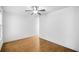 Empty bedroom featuring hardwood floors, neutral walls, and bright natural light at 507 Ridge View Xing, Woodstock, GA 30188