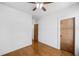 Empty bedroom showcasing hardwood floors, neutral walls, and interior doors at 507 Ridge View Xing, Woodstock, GA 30188