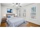 Bright bedroom with a large bed, plush carpet, and multiple windows for natural light at 507 Ridge View Xing, Woodstock, GA 30188