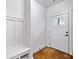 Mud room with hardwood floors, white trim and storage bench at 507 Ridge View Xing, Woodstock, GA 30188