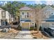 Attractive townhome showcasing a single car garage, neutral colors, and manicured front lawn at 507 Ridge View Xing, Woodstock, GA 30188