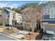 Charming townhome featuring a single car garage, neutral colors, and landscaped front yard at 507 Ridge View Xing, Woodstock, GA 30188