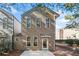 Two-story home featuring multiple windows for natural light and a covered entrance at 507 Ridge View Xing, Woodstock, GA 30188