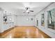 Bright, open-concept living room showcasing hardwood floors and seamless flow into the kitchen area at 507 Ridge View Xing, Woodstock, GA 30188