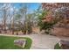 Backyard with a manicured lawn, decorative stones, and mature trees creating a serene outdoor setting at 731 Mollie Se St, Atlanta, GA 30316