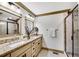 Bathroom featuring double vanities, granite countertops, and tiled floors at 731 Mollie Se St, Atlanta, GA 30316