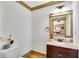 Powder room with granite countertop and a decorative flower at 731 Mollie Se St, Atlanta, GA 30316