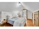 Bright bedroom with hardwood floors and a door leading to an ensuite bath at 731 Mollie Se St, Atlanta, GA 30316