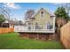 Exterior showcasing a charming deck and a well-manicured lawn, creating an inviting outdoor space at 731 Mollie Se St, Atlanta, GA 30316