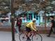 People enjoy outdoor activities, with a cyclist riding by colorful buildings, indicating an active community at 731 Mollie Se St, Atlanta, GA 30316