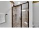 Tiled shower with glass door and built-in seat at 731 Mollie Se St, Atlanta, GA 30316