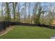Expansive backyard with lush green grass, black privacy fence and a storage shed at 2111 Drew Valley Ne Rd, Brookhaven, GA 30319