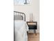 Bedroom boasts a stylish black nightstand featuring a rattan drawer front and a uniquely designed lamp at 2111 Drew Valley Ne Rd, Brookhaven, GA 30319