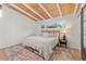 Bright bedroom boasts a wood ceiling, a large rug and natural light from the horizontal window at 2111 Drew Valley Ne Rd, Brookhaven, GA 30319