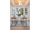 Bright dining area with a modern white table, chairs, and large windows at 2111 Drew Valley Ne Rd, Brookhaven, GA 30319