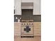 Modern kitchen showcases stainless steel Viking stove and decorative backsplash at 2111 Drew Valley Ne Rd, Brookhaven, GA 30319