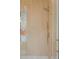 Close up of a shower with vertical wood grain tile, glass door, and gold hardware at 2111 Drew Valley Ne Rd, Brookhaven, GA 30319