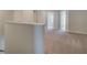 Upstairs hallway features neutral carpet, gray walls, and white trim around the open doorways at 321 Heavenly Hollow Pl, Mcdonough, GA 30253