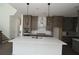 Modern kitchen boasts a center island, pendant lighting, and stainless steel appliances at 4445 Beechnut Cir, Cumming, GA 30028